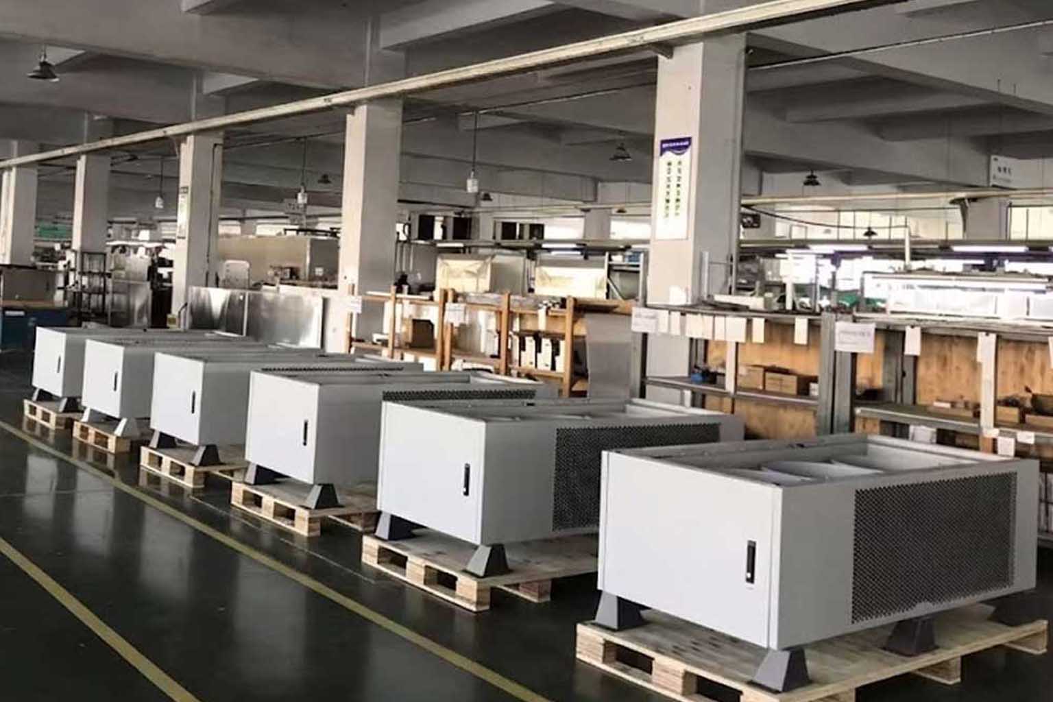 System integration and final assembly of commercial EV charging equipment within controlled manufacturing processes